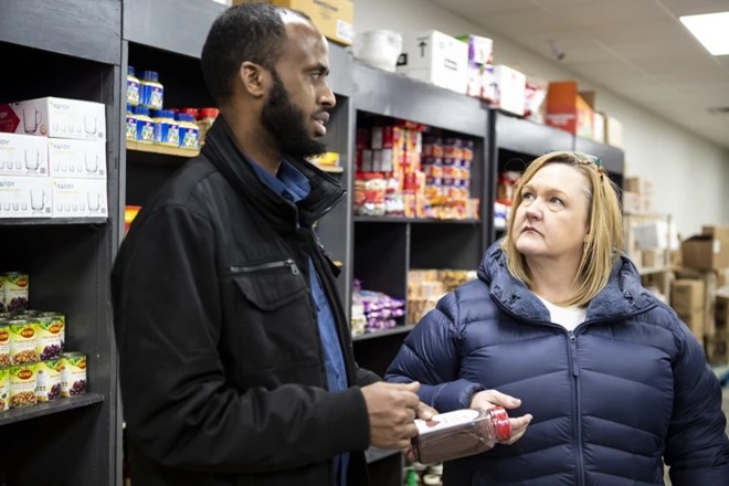 Barbara Marks, right, listens to Amin Grocery owner Abdiweli Yusuf speak about products he sells in his store on Thursday, March 9, 2023.Macy Moore / West Central Tribune