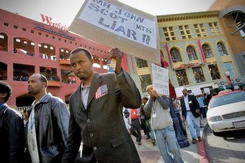 Striking cabdrivers protested yesterday near City Hall, later marching down Broadway to the Hall of Justice and Horton Plaza. 