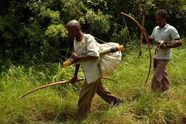 Men flee Pandanguo in July 2014 following attacks by Al-Shabaab militants. Residents of Pandaguo Village in Lamu are living in fear after a 22-year-old man Monday reported to have come into contact with suspected Al-Shabaab militants when he went to harvest honey in Boni Forest.