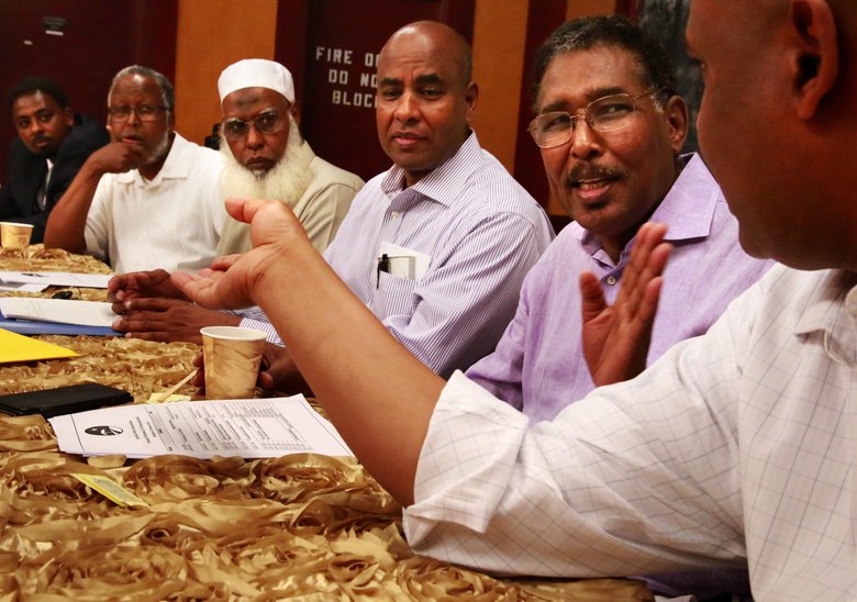 Abdulkadir Aden Mohamud, right in purple, and Abdulhakim Hashi, to his right in stripes, are in a task force to ensure that Somalis of Washington have a voice in the country’s election.