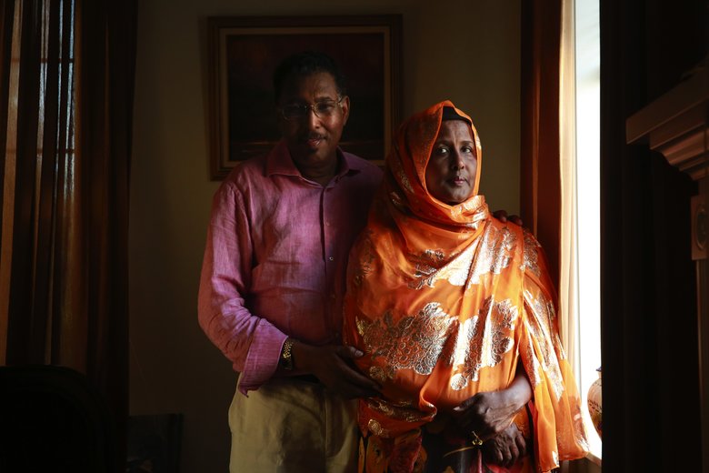 Abdulkadir Aden Mohamud, also known as “Jangeli,” and his wife, Hamdi Abdulle, executive director of the Somali Youth & Family Club, are photographed in their home in Renton. Mohamud worked as the head of Somalia’s development bank in the 1980s.