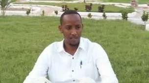 Abdinur Mohamed Ahmed, pictured here in Mogadishu's Peace Garden, wants young Somalis to stay and rebuild their country.