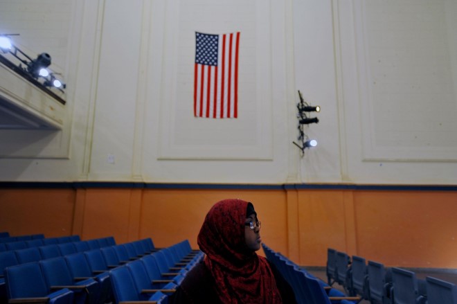Hamdi Mohammad, who graduated in 2011, watches her friends at Washburn High School during a 2012 theater rehearsal.