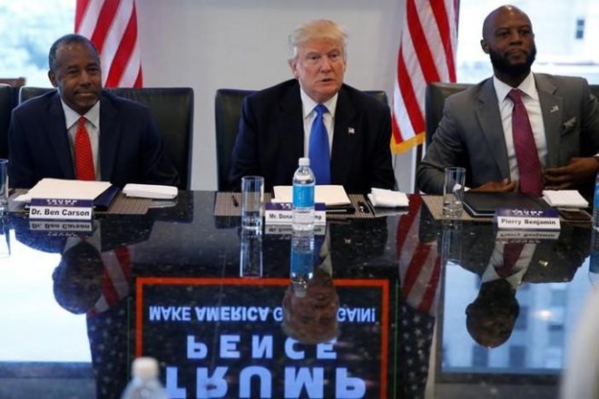 Dr. Ben Carson (L) and Republican presidential nominee Donald Trump (C) and Pierry Benjamin (R) attend a round table with the Republican Leadership Initiative at Trump Tower in the Manhattan borough of New York,, U.S., August 25, 2016. REUTERS/Carlo Allegri