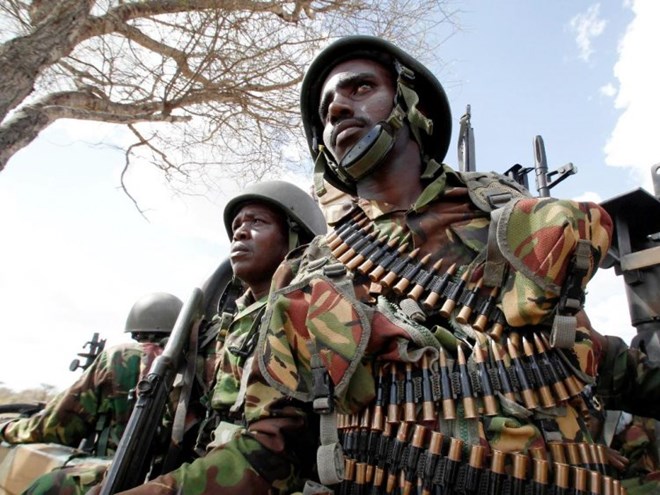 focused: Kenya Defence Force soldiers patrol Tabda village, 80km from the Kenya-Somalia border, on February 20, 2012.