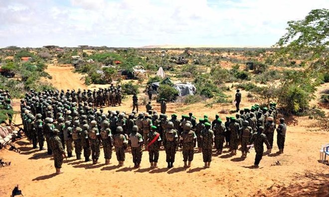 Afrian Union soldiers from Uganda being addressed by visiting Uganda's Chief of Defence Forces Gen. Katumba Wamala in the Somali town of Barawe in May 2015.