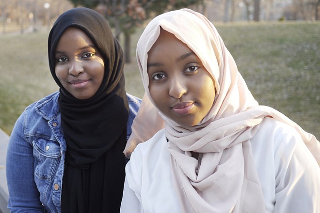 Sisters Khulud Hassan, left, and Zeinab Hassan of Mankato, Minn., say they support federal and private dollars to help Somali youth. "Being in the Somali community, I don't see a lot of support from the community towards youth like me," says Khulud Hassan, 17. Doualy Xaykaothao | MPR News
