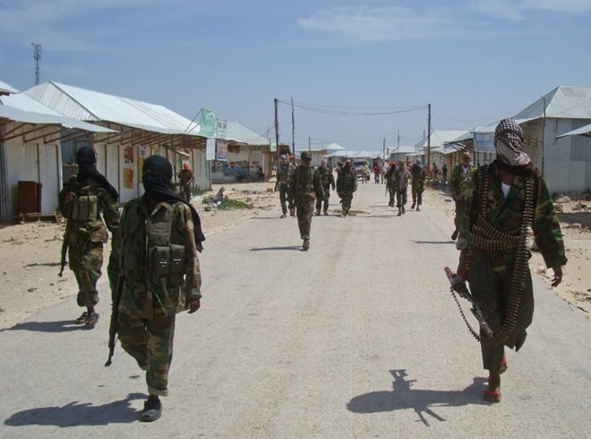 Al-Shabab recruits walk down a street in the Deniile district of Mogadishu, Somalia, March 5, 2012. The group has suffered setbacks in recent years but remains remarkably resilient to eradication by Somali and African Union troops.
MOHAMED ABDIWAHAB/AFP/GETTY IMAGES