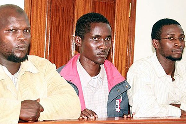 From left, Idris Magondu, Mohamed Addow and Hussein Hassan Agade in a court in Kampala, Uganda, when they faced charges over the 2010 bombing by the Al-Qaeda-linked Al-Shabaab that killed 76. FILE PHOTO | NATION MEDIA GROUP