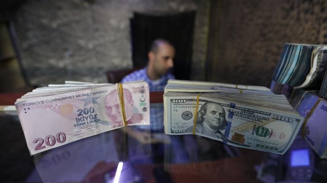Two years after a devastating currency crisis that brought on a recession and spurred an exodus of foreign investment, the lira was close to halving in value from the beginning of 2018 [File: Khalil Ashawi/Reuters]