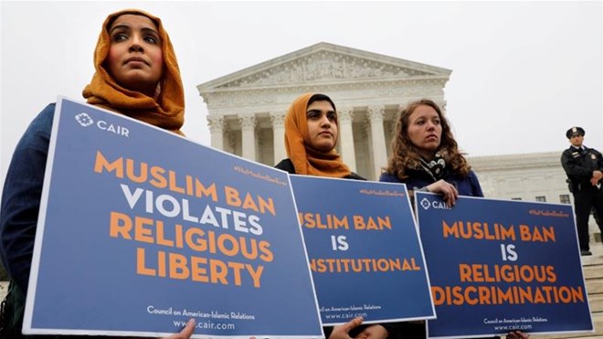 Trump's initial ban targeted immigrants from Iran, Libya, Somalia, Syria and Yemen, triggering criticism that it amounted to unlawful religious discrimination [File:Yuri Gripas/Reuters]