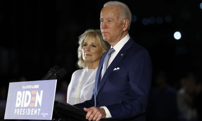 MATT ROURKE – ASSOCIATED PRESS - Democratic presidential candidate former Vice President Joe Biden, accompanied by his wife Jill, speaks to members of the press at the National Constitution Center in Philadelphia, Tuesday, March 10, 2020.