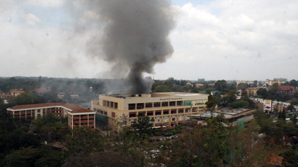 Heavy smoke is seen from the site of the terrorist attack, Westgate Mall, on September 23, 2013 in Nairobi, Kenya. (Photo by Wiiliam Oeri/Nation Media/Gallo Images/Getty Images)