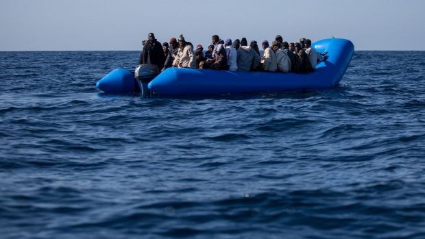 An inflatable boat off the Libyan coast. Over the past three years, tens of thousands of refugees and migrants have been caught trying to cross the Mediterranean Sea and detained without charge or trial. Photograph: Federico Scoppa/AFP/Getty