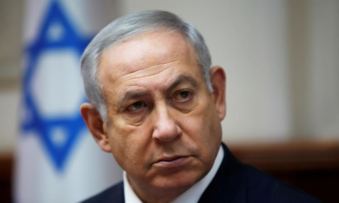 Netanyahu formally indicted in court on corruption charges