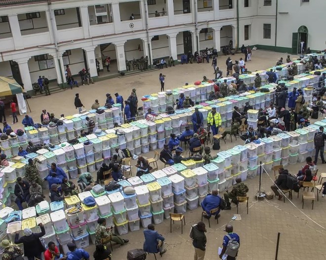 Ballot boxes lie stacked in rows at a tallying center in Nairobi, Kenya Wednesday, Aug. 10, 2022. Kenyans are waiting for the results of a close but calm presidential election in which the turnout was lower than usual. (AP Photo)