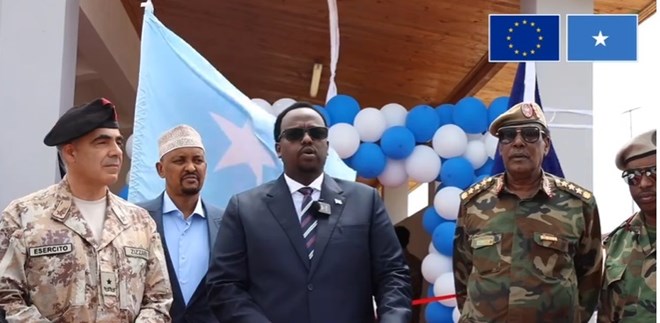 Deputy Prime Minister Salah Jama, alongside EU and Somali military officials, addresses attendees during the inauguration ceremony at the General Dhagabadan Training Center. (EU/Somalia)