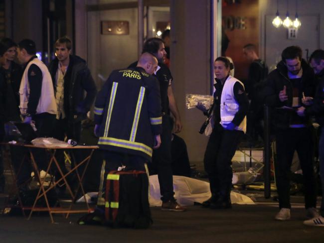 Deadly night ... Rescue workers and medics work on victims in a Paris restaurant.Source:AP