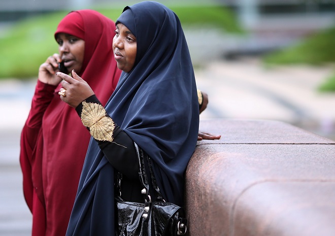 Ayan Abdurahman right, waited for a ride after attending a hearing for her son Zacharia Abdurahman one of seven defendants charged with conspiring to join ISIL Thursday September 17, 2015 in Minneapolis, MN.