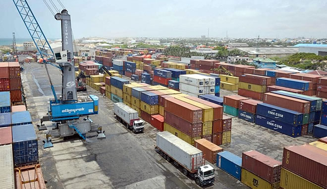 Shipping containers lie stacked in Mogadishu port in Somalia. Mogadishu’s port, having recently modernized to facilitate the shipping of containers, has made it much easier for the country to ship larger quantities of goods in and out of its port facilities. AMISOM PHOTO - TOBIN JONES