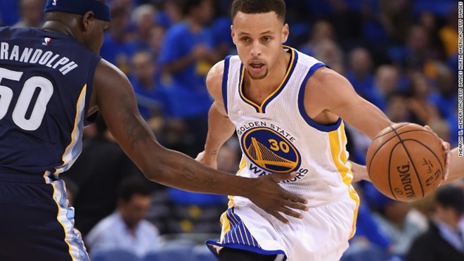 Stephen Curry of the Golden State Warriors dribbles the ball against Zach Randolph of the Memphis Grizzlies. Curry scored 46 points as the Warriors won to set the NBA season record for victories, at 73.