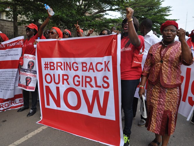 People attend a demonstration calling on the government to rescue the kidnapped girls of the government secondary school in Chibok, in Abuja, Nigeria, Tuesday, Oct. 14, 2014.