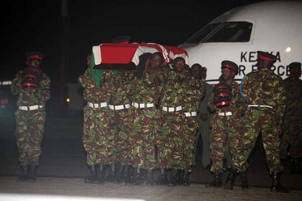 Soldiers at Wilson Airport carry the four bodies soon after being offloaded from a Kenya Air Force plane on January 18, 2016. Since 2009, the African Union peacekeepers has suffered at least 1,234 casualties. The conflict has directly killed at least 500,000 Somalis since 1991. PHOTO |EVANS HABIL