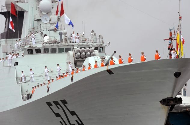 In Djibouti, China will build what's believed to be its first overseas military base. Here, Chinese sailors stand on the deck of the flagship missile frigate Ma'Anshan, which saw action against pirates off Somalia's coast in 2010. Ted Aljibe, AFP/Getty Images