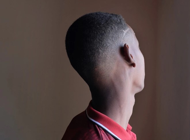 A 15-year-old defector from al-Shabab stands in early April in the Elman Center, a facility in Mogadishu that rehabilitates former child combatants. The boy and several others said they were forced to work as informants for the Somali intelligence agency. (Kevin Sieff/The Washington Post)