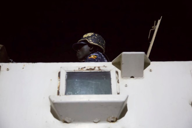 A female officer in AMISOM's police force during a night patrol in Mogadishu. (CHRISTINA GOLDBAUM | FOREIGN POLICY)