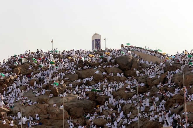 Muslim pilgrims gather on Mount Mercy on the plains of Arafat during the annual haj pilgrimage, outside the holy city of Mecca, Saudi Arabia, Sunday. | REUTERS