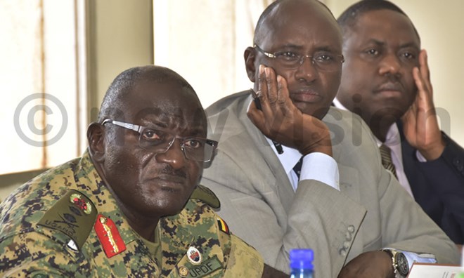 (L-R) UPDF Chief of Defense Forces Gen. Edward Katumba Wamala, State Minister for Internal Affairs Bright Rwamirama and Internal Affairs Minister Adolf Mwesige appearing before the Internal Affairs Committee of Parliament. Photo by Maria Wamala
