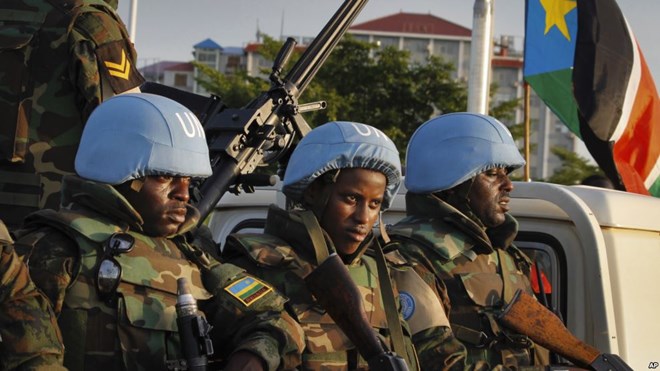 U.N. peacekeepers from Rwanda wait to escort members of the U.N. Security Council as they arrive at the airport in Juba, South Sudan, Sept. 2, 2016. The envoys arrived Friday to press the government to allow another 4,000 peacekeepers into South Sudan.