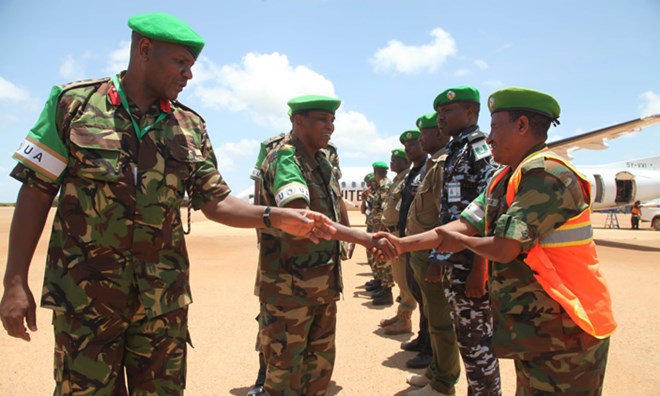 AMISOM Force Commander, Lt. Gen. Osman Noor Soubagleh (middle), greets senior AMISOM officers upon arrival in Kismayo, Somalia.
