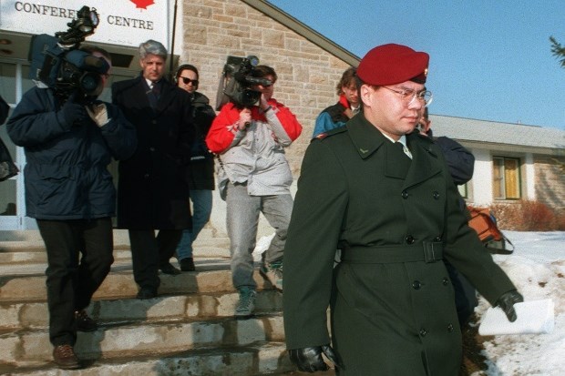 Pte. Kyle Brown is followed out of the courthouse at Canadian Forces Base Petawawa in March 1994. He was convicted of manslaughter and sentenced to five years for his role in the death of Arone. (John Hryniuk/Canadian Press)