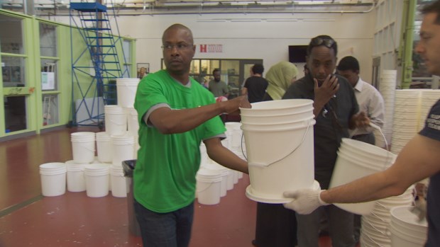 Local volunteers and members of the Canadian Somali community packed family emergency kits for African countries ravaged by severe drought conditions. (CBC)