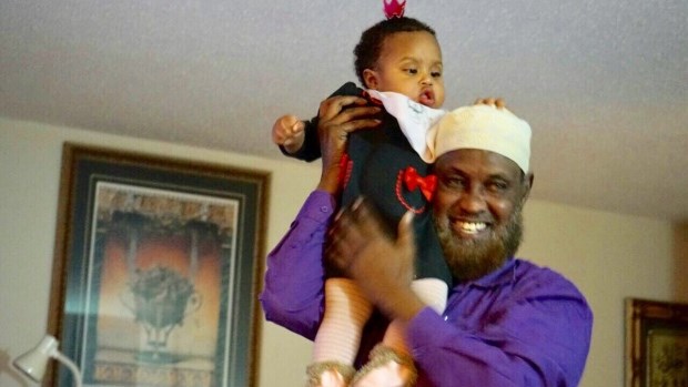 Sheikh Osman Barre, pictured here with his granddaughter Salma, was laid to rest Friday. (Supplied)