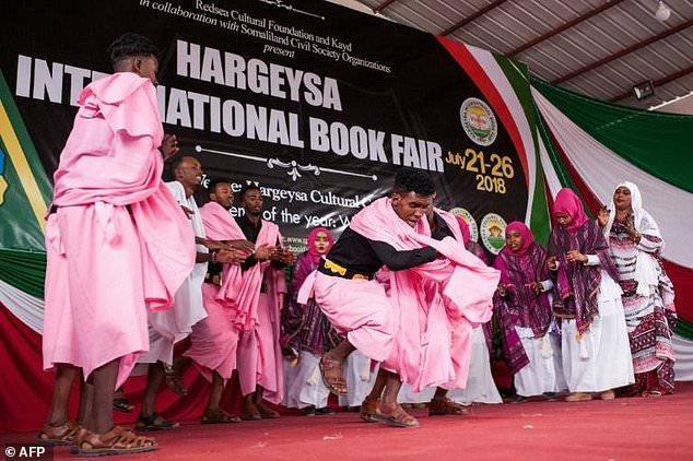 In the pink: Performers celebrate the start of the Hargeisa International Book Fair -- the event has restored life to a literary scene that once was one of the most vibrant in Africa