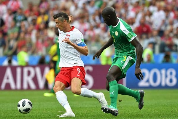 Poland's forward Robert Lewandowski (left) vies with Senegal's defender Kalidou Koulibaly during their 2018 World Cup Group H match at the Spartak Stadium in Moscow on June 19, 2018. PHOTO | FRANCISCO LEONG | AFP