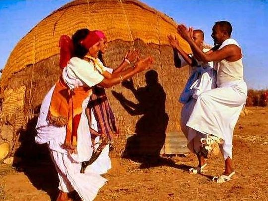 This is an aqal soomaali (AH-kahl so-MAH-lee), a portable house used by Somali nomadic families. It is made to be taken apart, loaded on a camel’s back, then rebuilt in a new place. An aqal Soomaali will be featured in In 