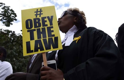 LSK Chief Executive Officer Mercy Wambua participates in a demonstration in Nairobi on February 15, 2018. Kenya has been ranked among world's most unhappy countries.