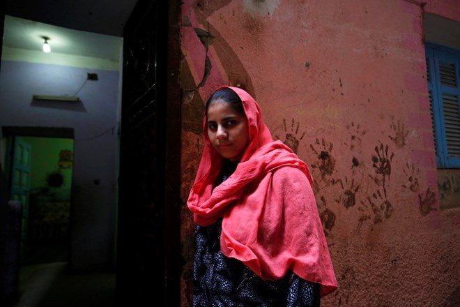 Nada Salah, 14, looks on outside her home in Alwasata village of Assiut Governorate, south of Cairo, Egypt, February 8, 2018. Picture taken February 8, 2018. REUTERS/Hayam Adel