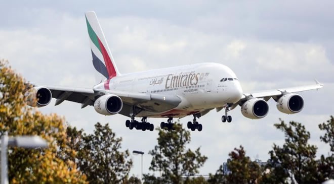 An Airbus SE A380 passenger aircraft, operated by Emirates Airline, prepares to land at London Heathrow Airport, in London, U.K., on Friday, Sept. 21, 2018. Dubai’s flagship airline Emirates is looking at taking over unprofitable neighbor Etihad, according to four people familiar with the matter, in a move that would create the world’s biggest carrier by passenger traffic. Photographer: Chris Ratcliffe/Bloomberg