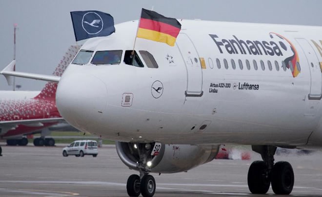 A plane carrying Germany national soccer team with a Lufthansa and a National flag rolls upon its landing at Vnukovo international airport, outside Moscow, Russia, June 12, 2018. (AP Photo/Alexander Zemlianichenko)