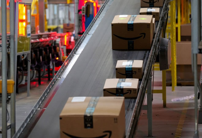 Amazon packages move along a conveyor at a fulfillment center in Robbinsville, N.J. (Bess Adler/Bloomberg News)
