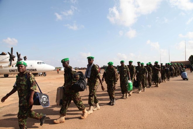 KDF troops get ready to board a plane as their rotation in Kismayo, Somalia. The troops have served in the southern city of Kismayo for over years now, as part of the African Union Mission in Somalia. AMISOM Photo/ Awil Abukar